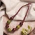 Wood beaded necklace, 'Tribal Dimension' - Geometric Green and Brown Haldu Wood Beaded Necklace