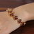 Gold-plated garnet tennis bracelet, 'Autumn Radiance' - 22k Gold-Plated Natural Garnet Tennis Bracelet from India