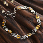 Citrine link bracelet, 'Joyous Shimmer' - Rhodium-Plated and Eight-Carat Natural Citrine Link Bracelet