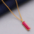 Gold-plated sterling silver and ruby pendant necklace, 'Vibrant Glam' - 18k Gold-Plated Necklace with Rectangular Ruby Stone Pendant