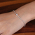 Sterling silver pendant bracelet, 'Sparkling Dot' - Polished Sterling Silver and Cubic Zirconia Pendant Bracelet