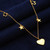 Collar con dijes bañados en oro - Collar con dijes chapado en oro de 22 k con temática de corazón, estrella y Hamsa