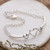 Cubic zirconia pendant bracelet, 'Shimmering Hearts' - Heart-Themed Cubic Zirconia Sterling Silver Pendant Bracelet