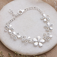 Cubic zirconia link bracelet, 'Gleaming Blossoms' - Floral-Themed Cubic Zirconia Sterling Silver Link Bracelet