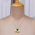 Onyx pendant necklace, 'Glowing Era' - High-Polished Brass and Green Onyx Pendant Necklace