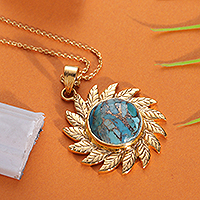 Brass pendant necklace, 'Arcadian Sun' - Sun-Themed Leafy Reconstituted Turquoise Pendant Necklace