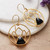 Onyx dangle earrings, 'Lotus Night' - Lotus-Themed Brass and Black Onyx Dangle Earrings from India