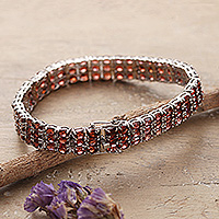 Rhodium-plated garnet wristband bracelet, 'Passionate Brilliance' - 27-Carat Natural Oval Garnet Wristband Bracelet from India