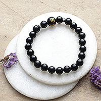 Onyx stretch beaded bracelet, 'Immortal Om' - Artisan-Made Onyx Stretch Beaded Bracelet with Om Pendant