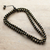 Onyx beaded necklace, 'Immortal Om' - Handmade Om-Inspired Onyx Beaded Long Necklace from India