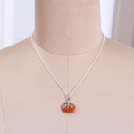 Carnelian and quartz pendant necklace, 'Courageous Flutter' - Natural Carnelian Dragonfly Pendant Necklace with Quartz Gem