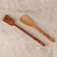 Wood spatulas, 'Stir in Smiles' (set of 2) - Hand-Carved 2-Piece Neem Wood Spatula Set Crafted in India