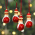 Wood ornaments, 'Santa Gathering' (set of 4) - Santa-Themed 4-Piece Painted Pala Indigo Wood Ornament Set