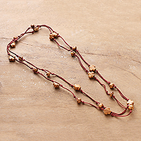 Wood long station necklace, 'Starry Fire' - Bohemian Red Haldu Wood Station Necklace with Star Beads