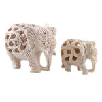 Soapstone sculptures, 'Elephant Bonds' (set of 2) - Jali-Themed 2-Piece Carved Soapstone Elephant Sculpture Set
