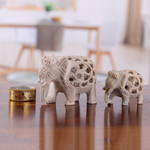 Soapstone sculptures, 'Elephant Bonds' (set of 2) - Jali-Themed 2-Piece Carved Soapstone Elephant Sculpture Set