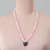 Rose quartz and hematite beaded pendant necklace, 'Heart of Harmony' - Natural Rose Quartz and Hematite Heart Pendant Necklace