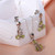 Peridot jewelry set, 'Lucky Blooms' - Leafy 4-Carat Oval Peridot Necklace and Earrings Jewelry Set