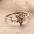 Garnet band ring, 'Blossoming Scarlet' - Floral-Themed Sterling Silver Band Ring with Garnet Gemstone