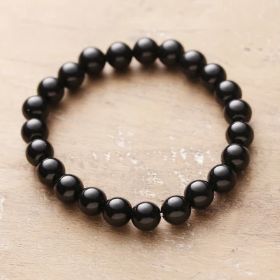 Obsidian beaded stretch bracelet, 'Souls of Transformation' - Natural Obsidian Beaded Stretch Bracelet Handmade in India