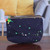 Cotton cosmetic bag, 'Splash of Colors' - Painted Cotton Cosmetic Bag with Wooden Parrot-Themed Charm