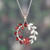 Garnet pendant necklace, 'Captivating Garden' - Floral and Leaf-Inspired Garnet and Silver Pendant Necklace