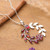 Garnet pendant necklace, 'Captivating Garden' - Floral and Leaf-Inspired Garnet and Silver Pendant Necklace