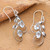 Blue topaz dangle earrings, 'Soothing Leaves' - Leaf Tendril-Themed Silver Earrings with Blue Topaz Stones