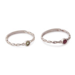 Ruby and peridot stacking solitaire rings, 'Dual Allure' (pair) - Ruby Peridot Sterling Silver Stacking Solitaire Rings (Pair)