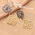 Brass drop earrings, 'Modern Spirals' - Spiral-Themed Modern Darkened Polished Brass Drop Earrings