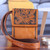 Leather sling bag, 'Timeless Elegance in Tan' - Tan Leather Sling Bag with Embossed Floral Paisley Designs