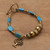 Resin and brass beaded charm bracelet, 'Tree of Calm' - Brass and Turquoise-Toned Resin Beaded Tree Charm Bracelet