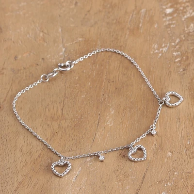 Cubic zirconia charm bracelet, 'Dainty Hearts' - Silver Bracelet with Textured Heart Cubic Zirconia Charms