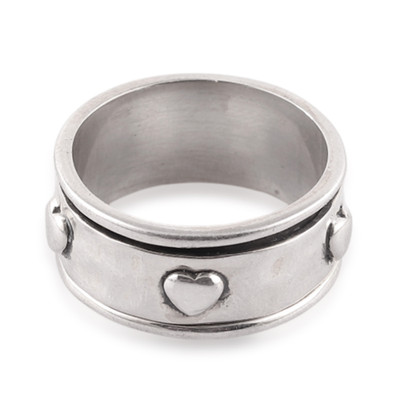 Sterling silver meditation spinner ring, 'Rotating Hearts' - Heart-Themed Sterling Silver Meditation Spinner Ring