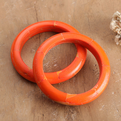 Handcrafted bangle bracelets, 'Orange Aura' (pair) - Bohemian-Inspired Polished Bangle Bracelet Pair in Orange