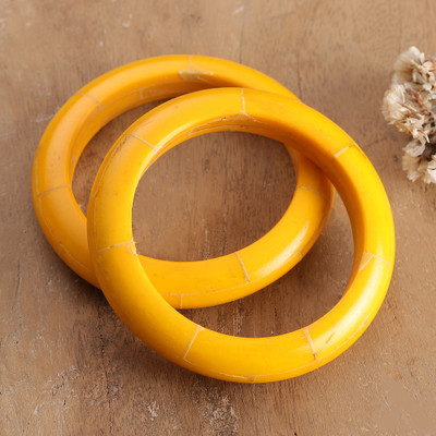 Handcrafted bangle bracelets, 'Jolly Aura' (pair) - Polished Bohemian Style Bangle Bracelet Pair in Yellow Hues