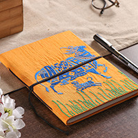 Handmade paper journal, 'Kamadhenu in Saffron' - Folk Art-Inspired 58-Page Handmade Paper Journal from India