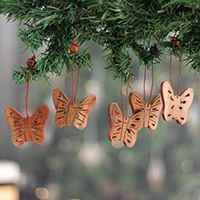 Wood ornaments, 'Blissful Flutter' (set of 5) - 5 Butterfly-Themed Hand-Carved Wooden Christmas Ornaments