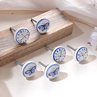 Ceramic knobs, 'Butterfly Hour' (set of 6) - Whimsical Butterfly and Clock 6-Piece White Ceramic Knob Set