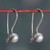 Sterling silver drop earrings, 'Globe Duo' - Avant-Garde High-Polished Sterling Silver Drop Earrings (image 2) thumbail