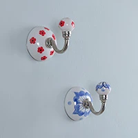 Ceramic hooks, 'Blooming Hook' (set of 2) - Spring-Inspired Blue and Red Bloom 2-Piece Ceramic Hook Set