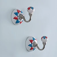 Ceramic hooks, 'Jolly Petals' (pair) - Hand-Painted Floral Blue and Red Ceramic and Iron Hook Pair