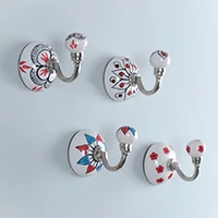 Ceramic hooks, 'Primaveral Touch' (set of 4) - Handmade Painted Floral 4-Piece Ceramic and Iron Hook Set