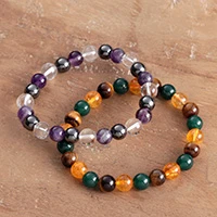 Multi-gemstone beaded stretch bracelets, 'Forest and Dawn' (pair) - Pair of Multi-Gemstone Stretch Bracelets Handmade in India