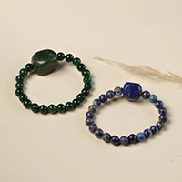 Aventurine and lapis lazuli beaded stretch pendant bracelets, 'Bold Duet' (pair) - Aventurine and Lapis Lazuli Stretch Pendant Bracelets (Pair)