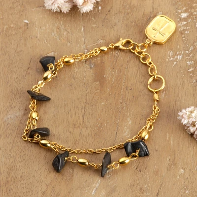 Onyx station bracelet, 'Pebbled Midnight' - Black Onyx and Gold Brass Station Bracelet with Cross Charm