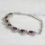 Garnet link bracelet, 'Nature's Delight' - Floral Garnet Bracelet Handcrafted in Sterling Silver