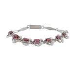 Garnet link bracelet, 'Nature's Delight' - Floral Garnet Bracelet Handcrafted in Sterling Silver