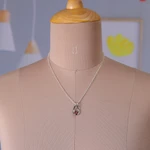 Garnet pendant necklace, 'Angel of Love' - Sterling Silver and Garnet Necklace Modern Jewelry