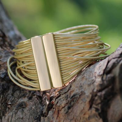 Gold accent leather wristband bracelet, 'Golden Brazilian Glam' - Golden Leather Bracelet with Gold Plated Clasp